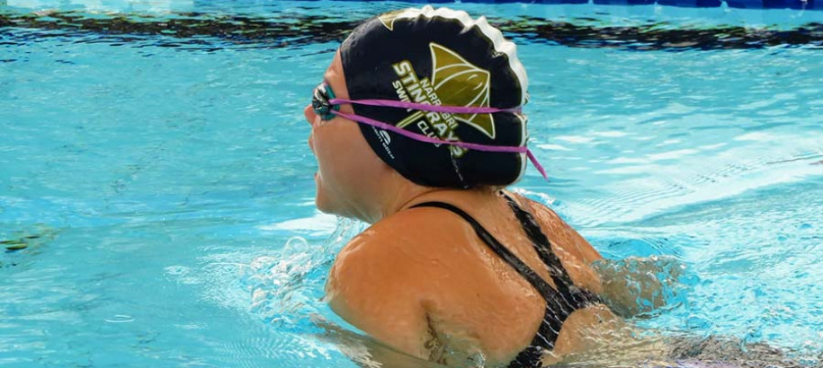 Narrabri Stingrays SC breaststroke swimmer wearing club cap