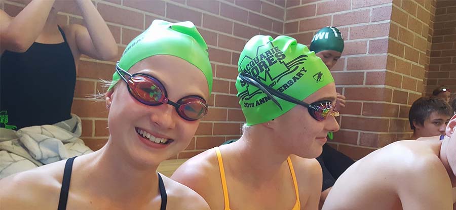 Macquarie Shores SC swimmers with green caps