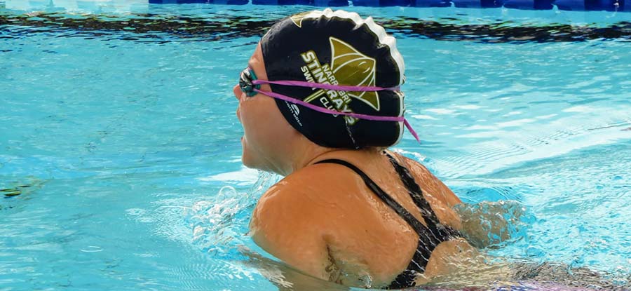 Narrabri Stingrays SC breaststroke swimmer wearing club cap