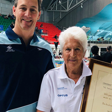 Dawn Fraser OAM is awarded two World Record Certificates by Chris Fydler OAM