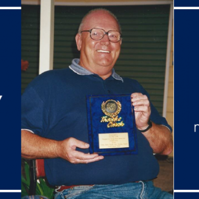 Frank Law pictured holding award