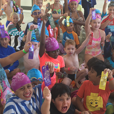 Kids from many cultural backgrounds having fun at swim club