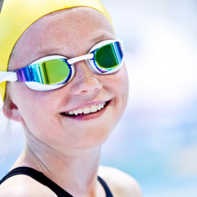Happy young female swimmer smiling