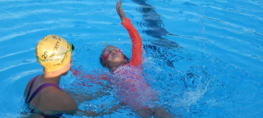 Swimming lessons learn to swim first lap