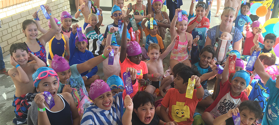 Kids from many cultural backgrounds having fun at swim club