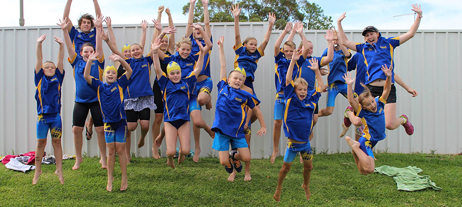 Swim Club members jumping in the air