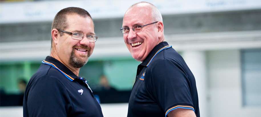 Two male Technical Officials working at a meet