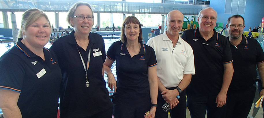Swimming NSW officials working together at a development meet