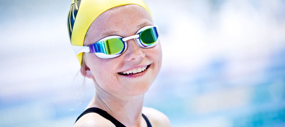 Happy young female swimmer smiling
