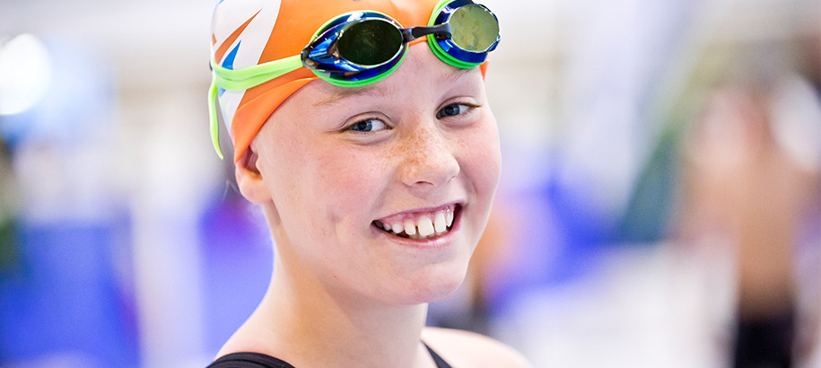 Female Swimmer in cap and goggles