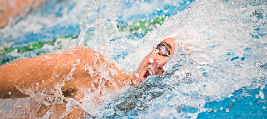 Competitive swimmer mid stroke