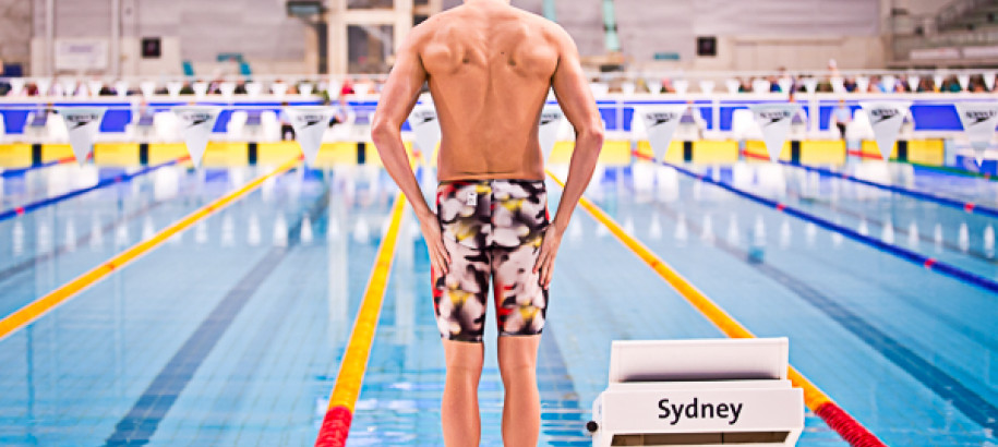 Swimmer waiting at the starting blocks