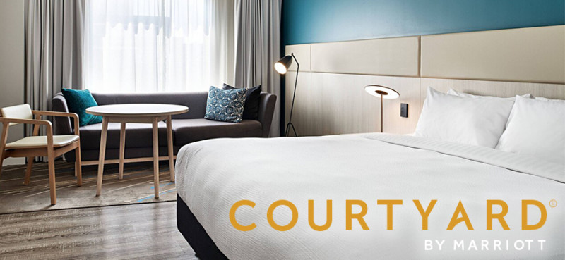 Courtyard by Marriott partnership hero image Courtyard by Marriott hotel room